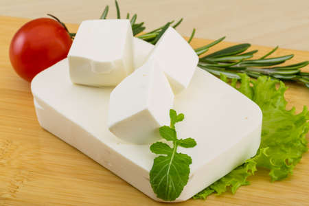 Traditional Greek Feta cheese with salad leavesの写真素材