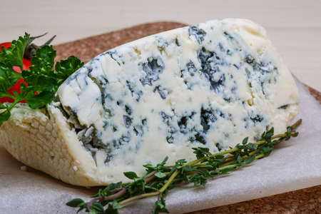 Blue cheese with thyme, tomato and parsleyの写真素材