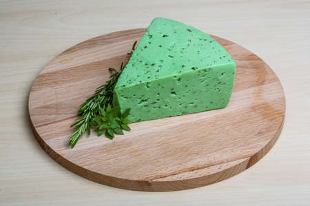 Green pesto cheese with rosemary basil leavesの写真素材
