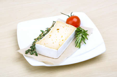 Soft brie cheese with rosemary, thyme and toast bread