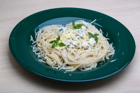 Pasta with blue cheese and fresh basilの写真素材