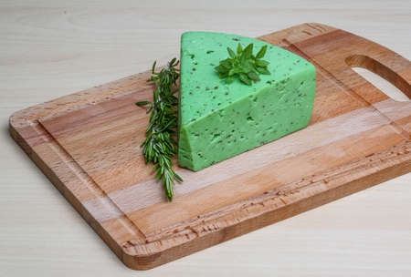 Green pesto cheese with rosemary basil leavesの写真素材