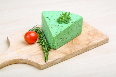 Green pesto cheese with rosemary basil leavesの写真素材