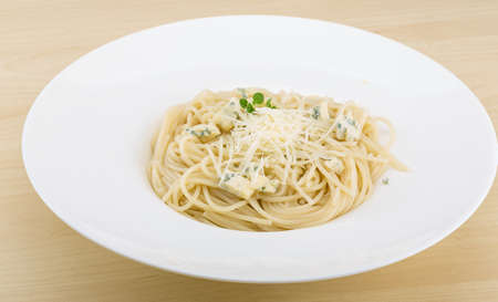 Spaghetti with various cheeses and green oreganoの写真素材