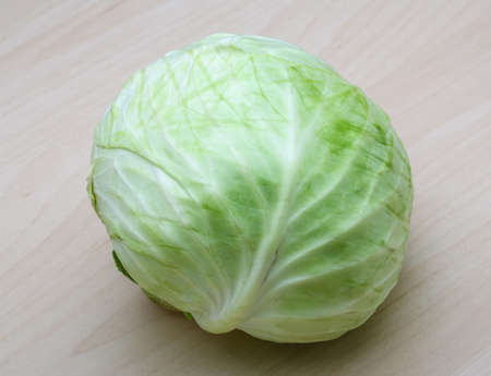 Fresh ripe cabbage on the wood backgroundの写真素材