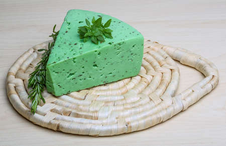 Green pesto cheese with rosemary basil leavesの写真素材