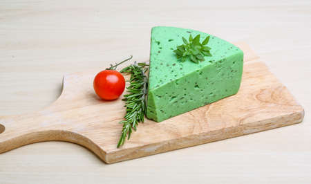 Green pesto cheese with rosemary basil leavesの写真素材