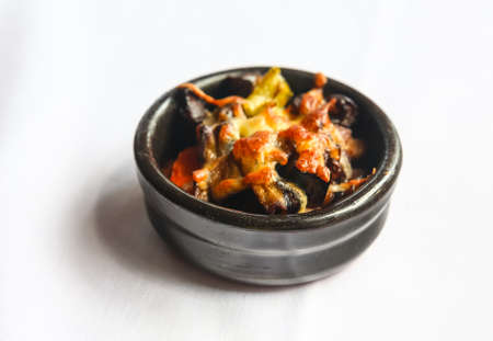 Pot with baked veal, potato and cheeseの写真素材