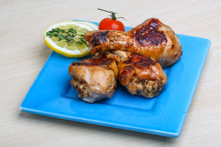 Roasted chicken legs in teriyaki sause with thymeの写真素材