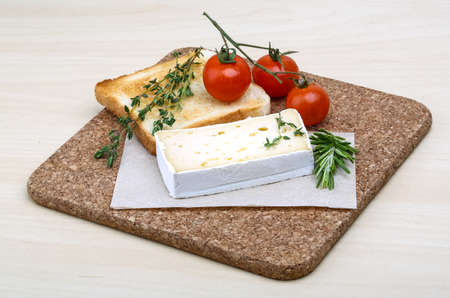 Soft brie cheese with rosemary, thyme and toast breadの写真素材