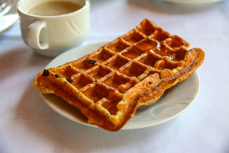 Belgian waffle with honey and fresh mintの写真素材