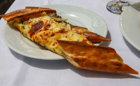 Turkish cheese pastry with fresh herbs and spicesの写真素材