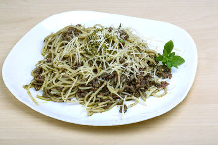 Pasta with beef, pesto sauce and cheeseの写真素材