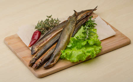 Smoked Lamprey - seafood delicacy with salad and herbsの写真素材