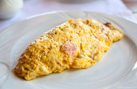Omelet with tomato, pepper, spices and cheeseの写真素材