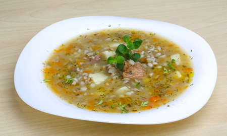 Cereal soup with pork meat and spicesの写真素材