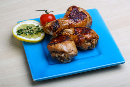 Roasted chicken legs in teriyaki sause with thymeの写真素材