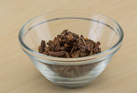 Clove seeds aroma on the wooden の写真素材