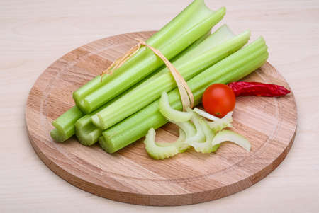 Fresh Green Celery sticks on the wood backgroundの写真素材