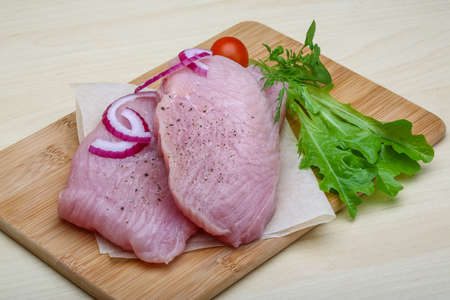 Raw turkey steaks with herbs - ready for cookingの写真素材