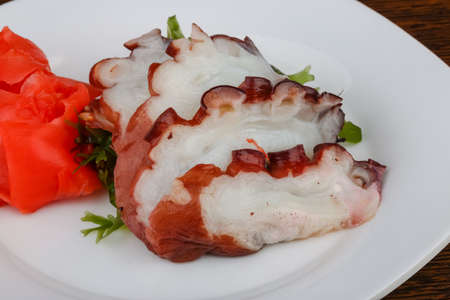 Fresh cold Octopus sashimi with nori and gingerの写真素材