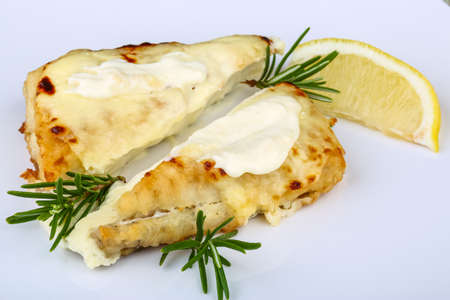 Baked perch with cheese, rosemary and lemonの写真素材