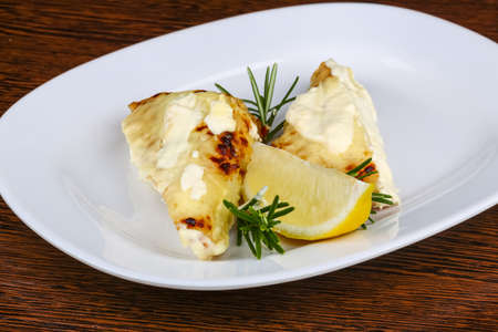 Baked perch fillet with rosemary and lemonの写真素材