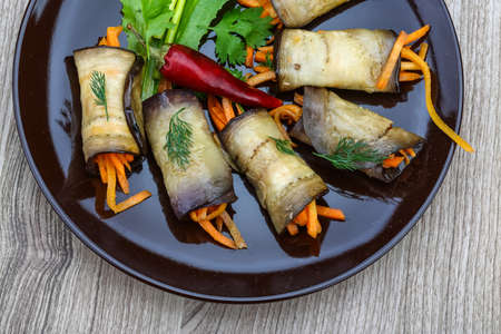 Eggplant rolls with carrot served spices and corianderの写真素材