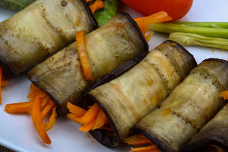 Eggplant rolls with carrot served spices and corianderの写真素材