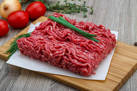 Raw minced beef meat with green oinion and dillの写真素材