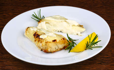 Baked perch fillet with rosemary and lemon