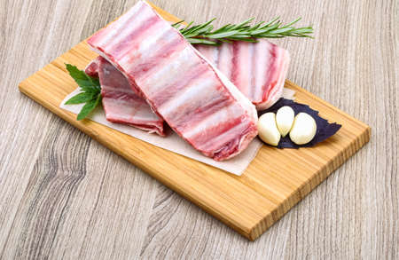 Fresh cold Raw lamb ribs with garlik and pepper - ready for cookingの写真素材