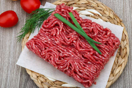 Raw minced beef meat with green oinion and dill