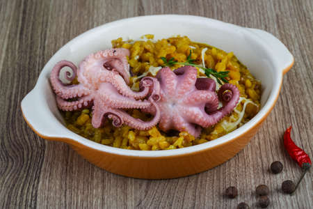Seafood risotto with octopus, cheese and thyme leafの写真素材