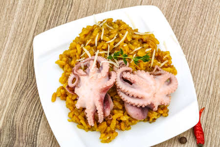 Seafood risotto with octopus, cheese and thyme leafの写真素材