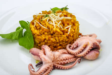 Seafood risotto with octopus, cheese and thyme leafの写真素材