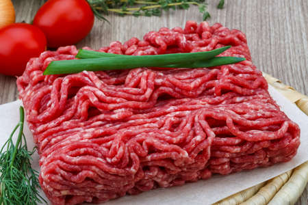 Raw minced beef meat with green oinion and dillの写真素材