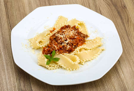 Pasta Bolognese with parmesan cheese and basil leavesの写真素材