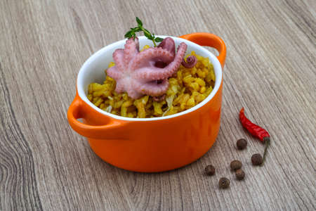 Seafood risotto with octopus, cheese and thyme leafの写真素材