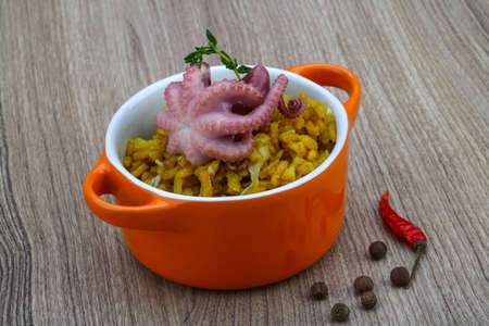 Seafood risotto with octopus, cheese and thyme leafの写真素材