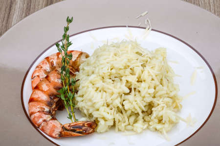 Italian trditional Risotto with tiger prawn and thymeの写真素材