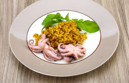 Seafood risotto with octopus, cheese and thyme leafの写真素材