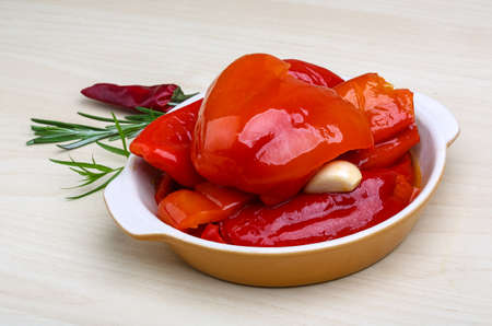 Marinated red pepper with garlik served rosemary branchの写真素材