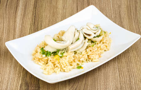 Risotto with calamari, parsley, garlik and lemonの写真素材