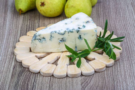 Blue cheese with rosemary and green pearの写真素材