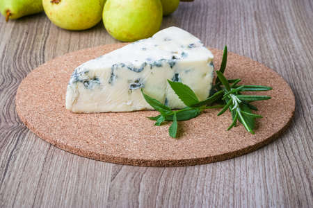 Blue cheese with rosemary and green pearの写真素材