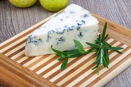 Blue cheese with rosemary and green pearの写真素材