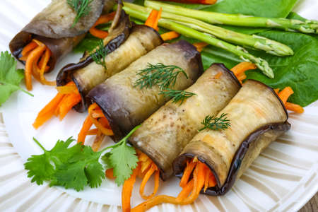 Eggplant rolls with carrot served spices and corianderの写真素材