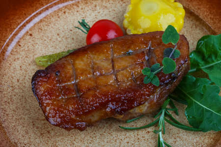 Roasted duck breast with rosemary and rucolaの写真素材
