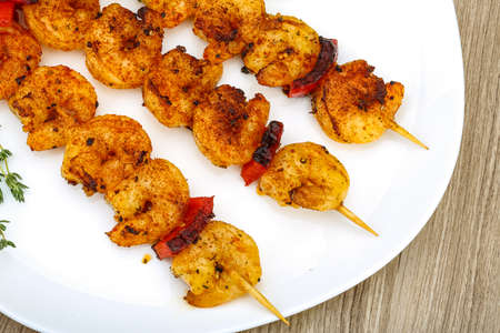 Grilled tiger prawn skewer with rosemary and spicesの写真素材